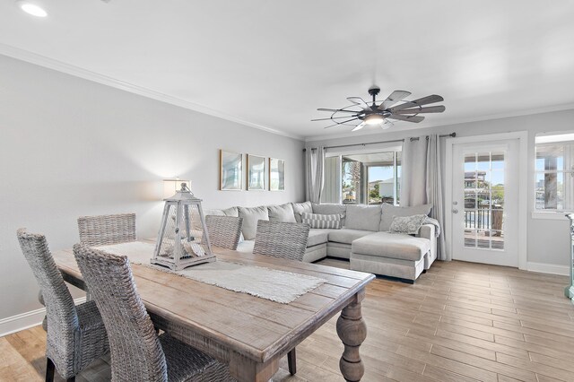 169 Durango Rd, Destin, FL 32541 - dining space with baseboards, ornamental molding, ceiling fan, and light wood-type flooring