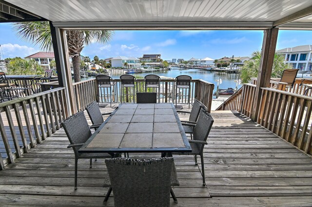 169 Durango Rd, Destin, FL 32541 - wooden deck featuring outdoor dining area, a water view, and a residential view