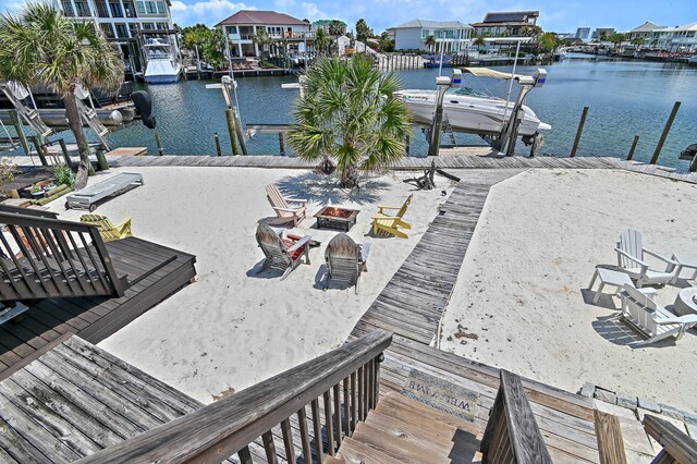 169 Durango Rd, Destin, FL 32541 - dock area featuring a water view, an outdoor fire pit, and boat lift