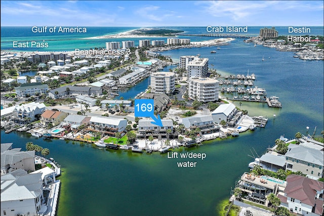birds eye view of property featuring a water view and a view of city