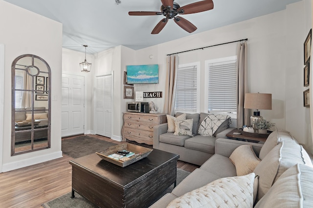10343 E County Highway 30a Unit B233, Rosemary Beach, FL 32461 - living area with baseboards, ceiling fan, and wood finished floors