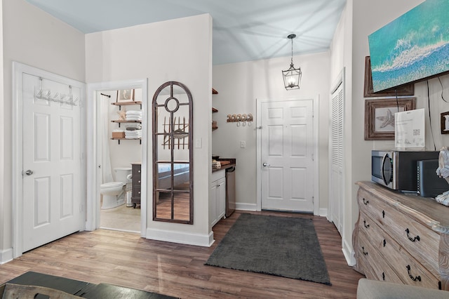 10343 E County Highway 30a Unit B233, Rosemary Beach, FL 32461 - entryway featuring baseboards and dark wood-type flooring