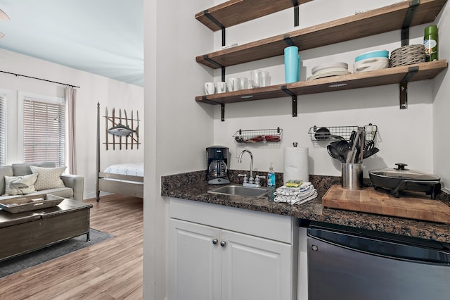 10343 E County Highway 30a Unit B233, Rosemary Beach, FL 32461 - bar with dishwashing machine, indoor wet bar, a sink, light wood-type flooring, and baseboards