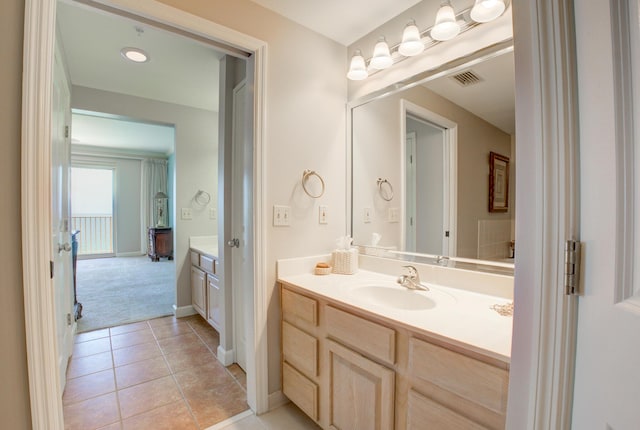8601 Surf Dr Unit 14E, Panama City Beach, FL 32408 - bathroom featuring vanity, baseboards, tile patterned flooring, and visible vents