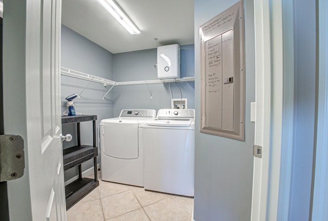8601 Surf Dr Unit 14E, Panama City Beach, FL 32408 - laundry area featuring laundry area, washing machine and dryer, and light tile patterned flooring