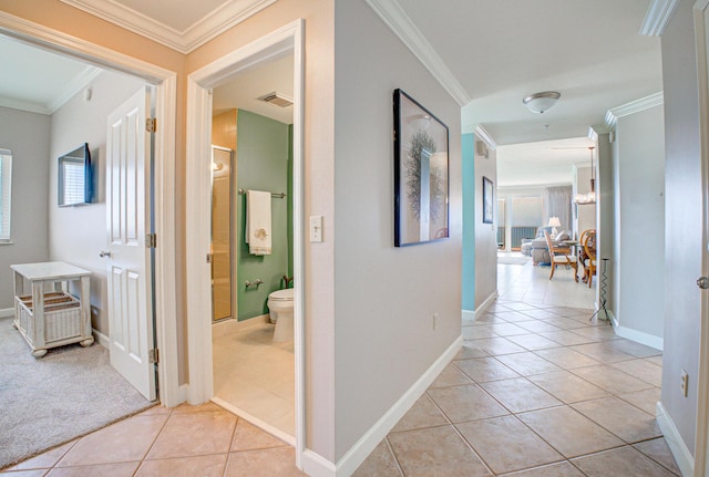 8601 Surf Dr Unit 14E, Panama City Beach, FL 32408 - hall featuring crown molding, light tile patterned flooring, baseboards, and visible vents
