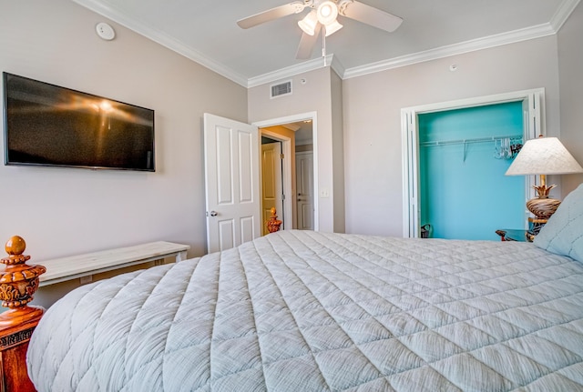8601 Surf Dr Unit 14E, Panama City Beach, FL 32408 - bedroom with visible vents, ornamental molding, a ceiling fan, and a closet