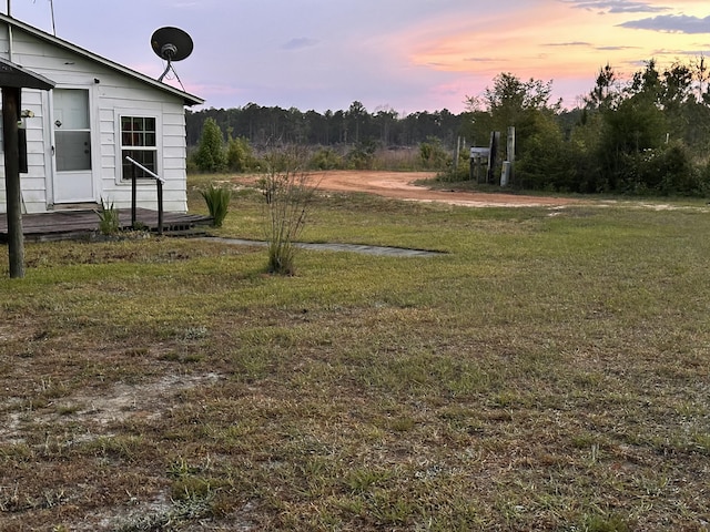 258 Briar Rd, Defuniak Springs, FL 32433 - yard at dusk with a yard