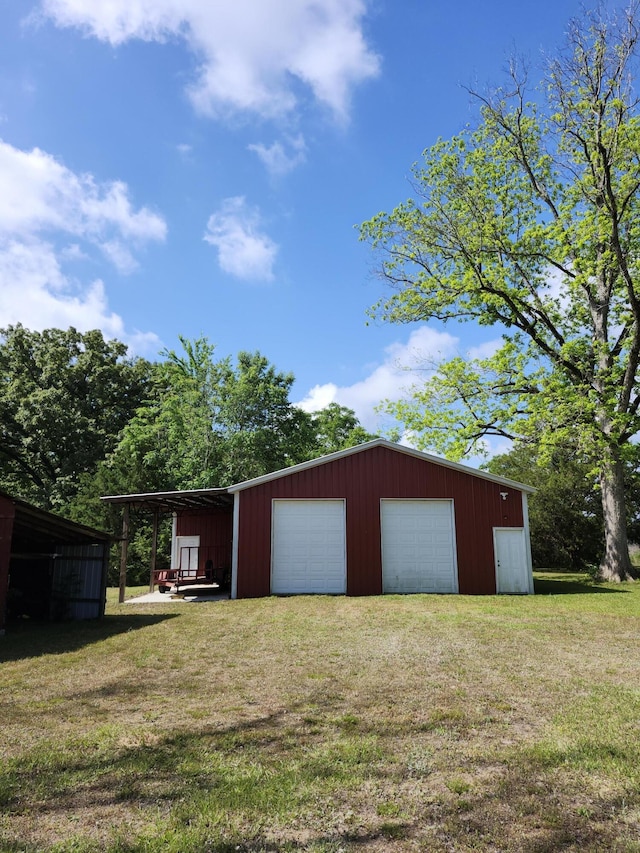 258 Briar Rd, Defuniak Springs, FL 32433 - garage with driveway and a garage