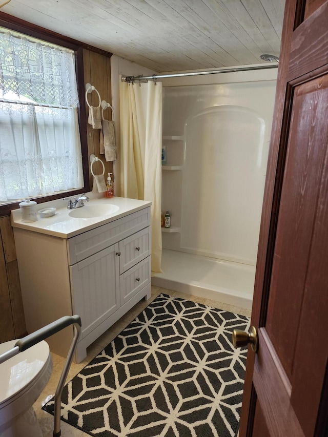258 Briar Rd, Defuniak Springs, FL 32433 - bathroom with a shower with curtain, vanity, wooden ceiling, and toilet