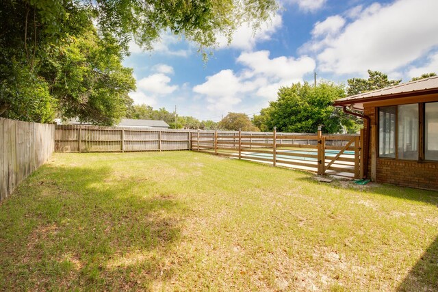 view of yard with a fenced backyard