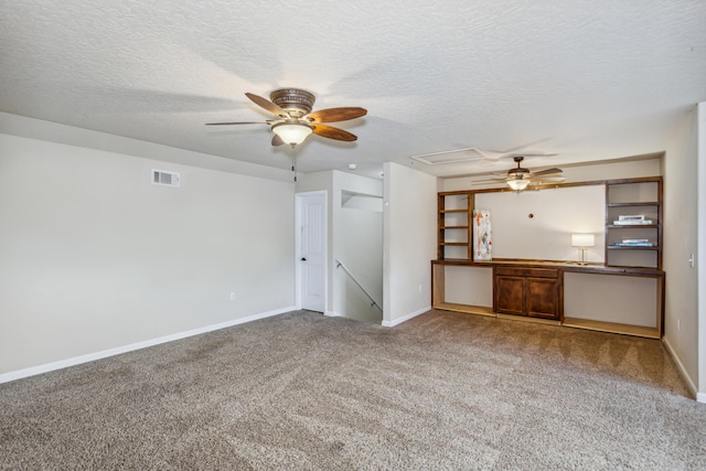 unfurnished living room featuring a ceiling fan, baseboards, visible vents, and carpet