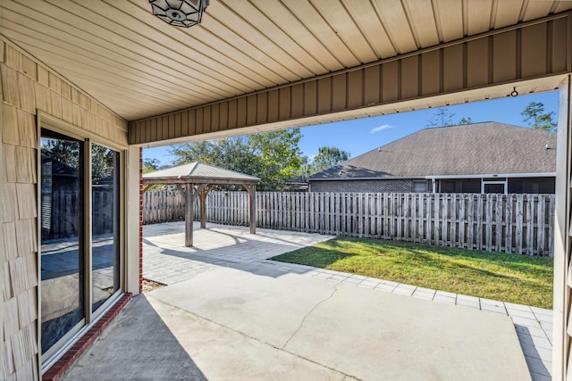 view of patio / terrace with a gazebo and a fenced backyard