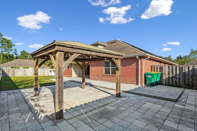 view of patio with a gazebo and a fenced backyard