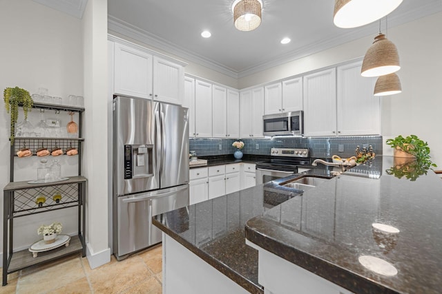 132 Carson Oaks Ln, Santa Rosa Beach, FL 32459 - kitchen with a sink, appliances with stainless steel finishes, crown molding, and decorative backsplash