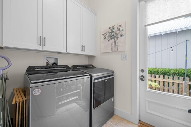 132 Carson Oaks Ln, Santa Rosa Beach, FL 32459 - washroom featuring light tile patterned floors, separate washer and dryer, baseboards, and cabinet space