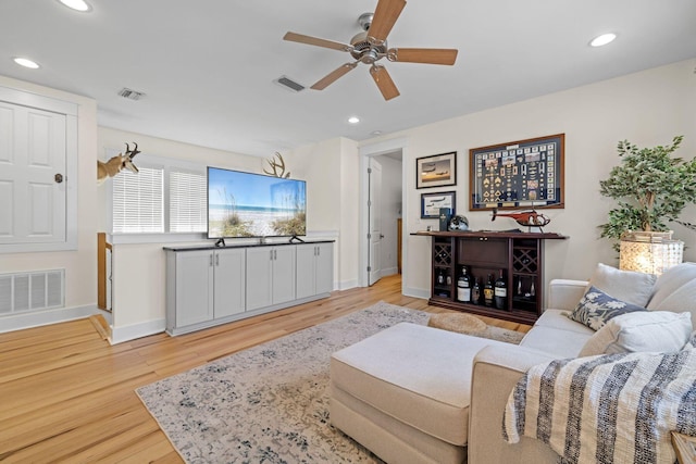 132 Carson Oaks Ln, Santa Rosa Beach, FL 32459 - living room featuring light wood-style floors, baseboards, a ceiling fan, and visible vents