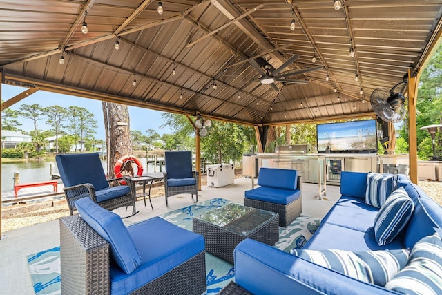 132 Carson Oaks Ln, Santa Rosa Beach, FL 32459 - view of patio with exterior kitchen, a gazebo, a ceiling fan, and an outdoor hangout area