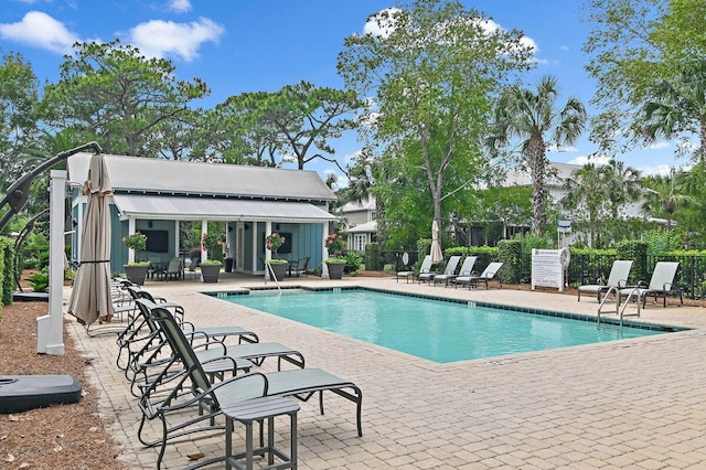 132 Carson Oaks Ln, Santa Rosa Beach, FL 32459 - community pool featuring fence, an outbuilding, an exterior structure, and a patio area