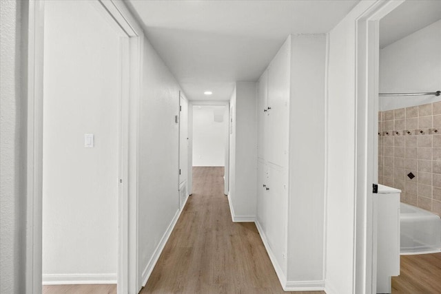 corridor with recessed lighting and light wood finished floors