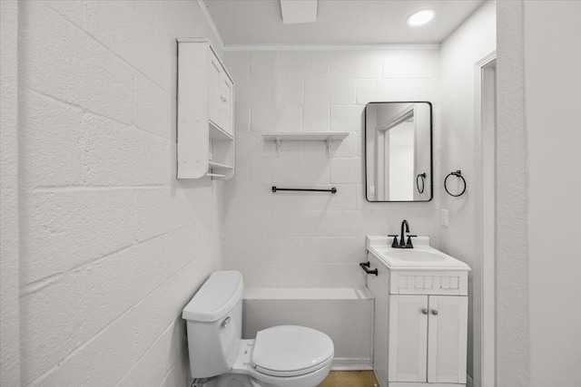 bathroom featuring vanity, ornamental molding, and toilet