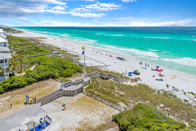aerial view featuring a view of the beach and a water view