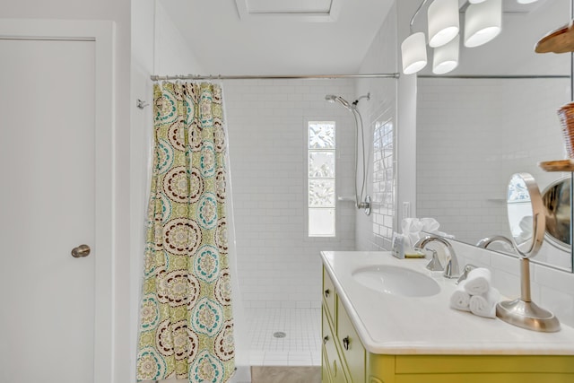 bathroom with vanity and a stall shower