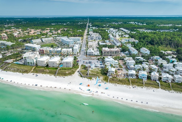 drone / aerial view with a water view and a view of the beach