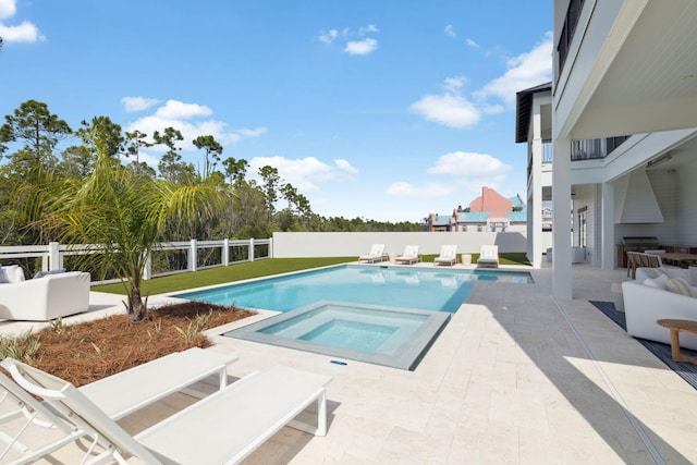 view of pool featuring an in ground hot tub, a fenced in pool, and a fenced backyard