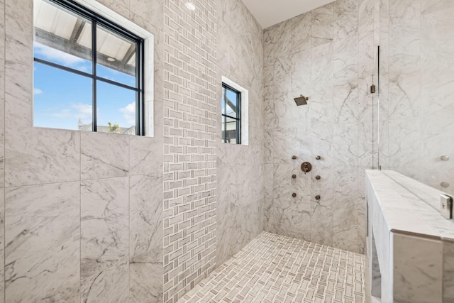 bathroom featuring a tile shower
