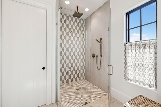 bathroom with tiled shower