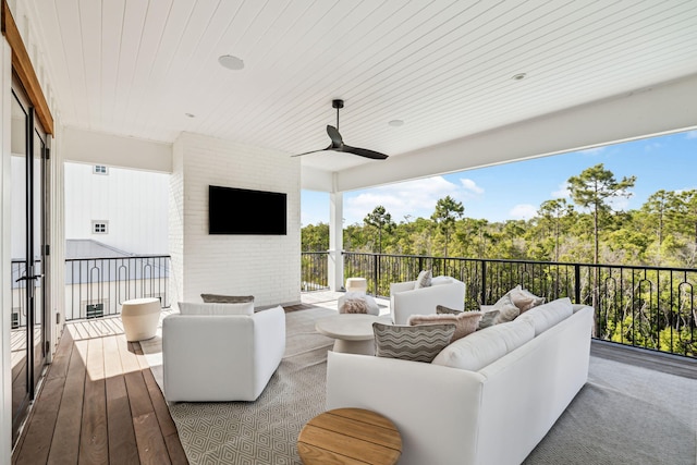 exterior space featuring a ceiling fan and an outdoor hangout area
