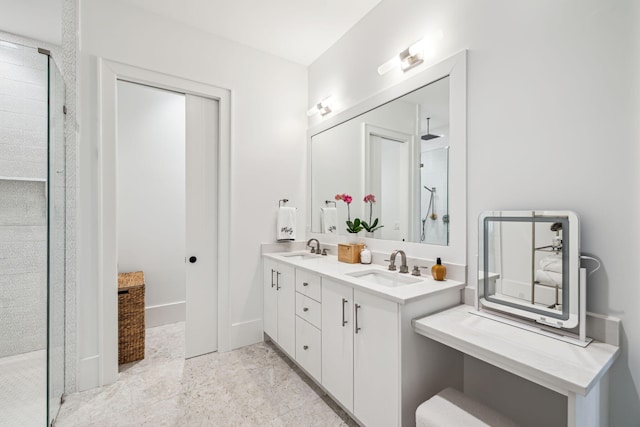 bathroom with double vanity, a sink, and a stall shower