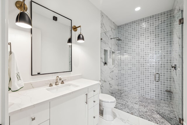 full bathroom featuring vanity, toilet, marble finish floor, recessed lighting, and a stall shower