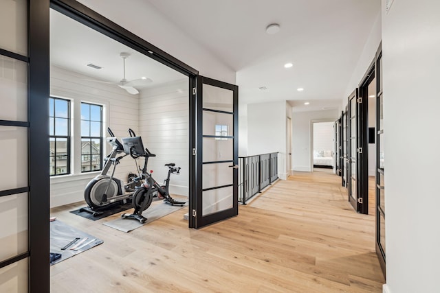 exercise room featuring light wood-style floors, baseboards, recessed lighting, and visible vents