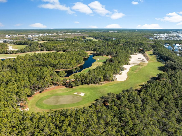 bird's eye view featuring a view of trees, a water view, and golf course view