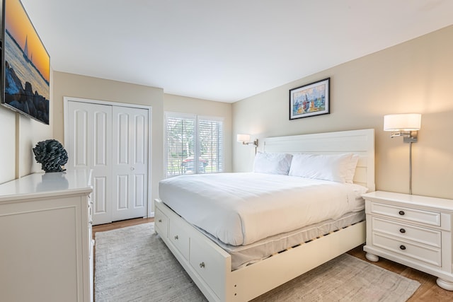 bedroom with a closet and light wood-style floors