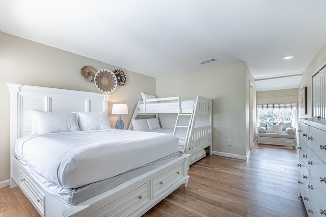 bedroom featuring recessed lighting, baseboards, visible vents, and light wood finished floors