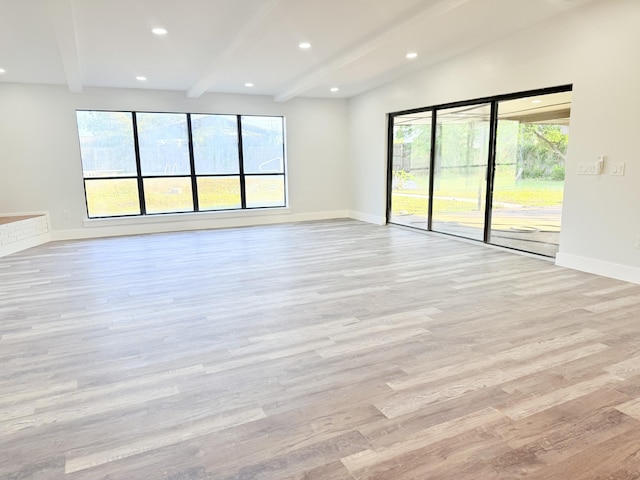 2710 Rutgers Dr, Panama City, FL 32405 - unfurnished living room featuring light wood-style flooring, beamed ceiling, baseboards, and recessed lighting