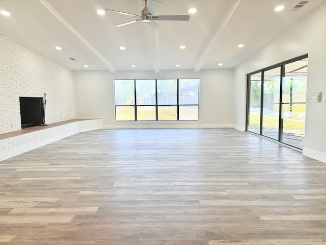 2710 Rutgers Dr, Panama City, FL 32405 - unfurnished living room featuring ceiling fan, a wealth of natural light, beamed ceiling, and wood finished floors