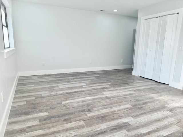 2710 Rutgers Dr, Panama City, FL 32405 - unfurnished bedroom featuring a closet, recessed lighting, baseboards, visible vents, and wood finished floors