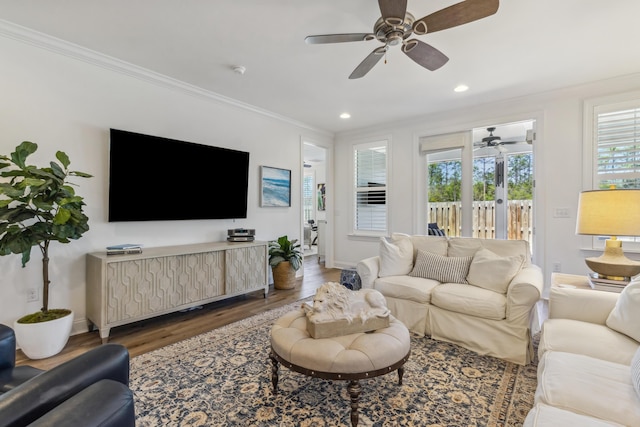 living room with ornamental molding, wood finished floors, baseboards, ceiling fan, and recessed lighting