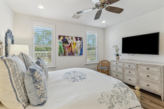 bedroom featuring a ceiling fan, recessed lighting, wood finished floors, and visible vents