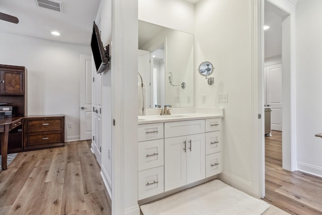 63 Windrow Way, Inlet Beach, FL 32461 - bathroom with baseboards, visible vents, wood finished floors, and vanity
