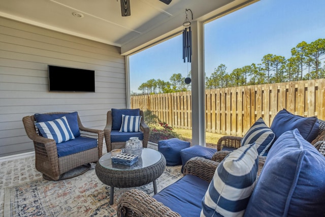 view of patio with fence and an outdoor hangout area
