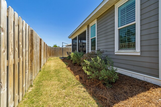 63 Windrow Way, Inlet Beach, FL 32461 - view of yard with a fenced backyard and a sunroom