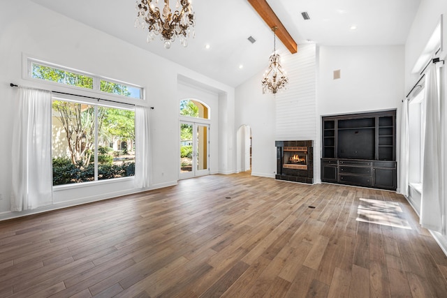 2928 Pine Valley Dr, Miramar Beach, FL 32550 - unfurnished living room featuring hardwood / wood-style floors, a notable chandelier, high vaulted ceiling, and beamed ceiling