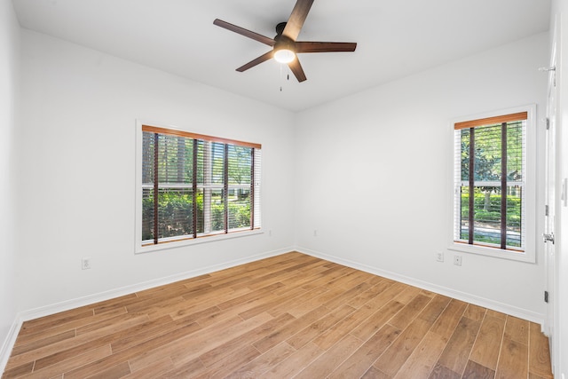 2928 Pine Valley Dr, Miramar Beach, FL 32550 - spare room featuring a ceiling fan, baseboards, plenty of natural light, and light wood-style floors