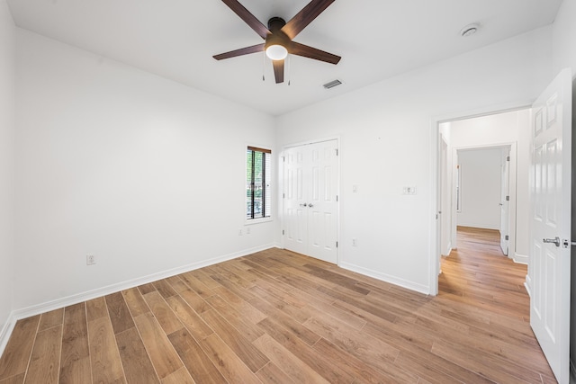 2928 Pine Valley Dr, Miramar Beach, FL 32550 - unfurnished bedroom with baseboards, a closet, light wood-style flooring, and visible vents
