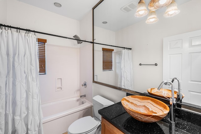 2928 Pine Valley Dr, Miramar Beach, FL 32550 - bathroom with visible vents, shower / tub combo with curtain, toilet, and vanity